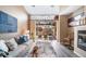 Bright living room featuring sliding doors to a patio and contemporary furnishings at 8626 Gold Peak Dr # B, Highlands Ranch, CO 80130