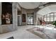 Inviting lobby area with tiled floors, recessed lighting, plants, and comfortable seating at 8626 Gold Peak Dr # B, Highlands Ranch, CO 80130