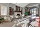 Comfortable lobby area featuring cozy seating, a fireplace with decorative shelving, and ample natural light at 8626 Gold Peak Dr # B, Highlands Ranch, CO 80130