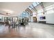 Bright and airy lobby with high ceilings, modern furniture, and abundant natural light at 8626 Gold Peak Dr # B, Highlands Ranch, CO 80130