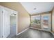 A room with a door to the outside and another to a room with carpet at 8626 Gold Peak Dr # B, Highlands Ranch, CO 80130