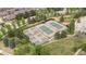 Aerial view of community tennis courts and pickleball courts with lush landscaping and surrounding homes at 8626 Gold Peak Dr # B, Highlands Ranch, CO 80130