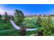 Expansive grassy area with a walking path, and neighborhood view at 12350 Turquoise Terrace St, Castle Pines, CO 80108