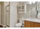 Well-lit bathroom with a stand up shower, cabinet, and white fixtures at 12350 Turquoise Terrace St, Castle Pines, CO 80108