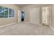 Bright bedroom with ample closet space and neutral carpeting at 12350 Turquoise Terrace St, Castle Pines, CO 80108