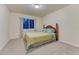 Bedroom with a comfortable bed with colorful bedding and a bright window at 12350 Turquoise Terrace St, Castle Pines, CO 80108