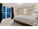 Cozy bedroom featuring a comfortable bed and a window with black curtains at 12350 Turquoise Terrace St, Castle Pines, CO 80108