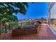 Wooden deck featuring a built-in flower box and views of the neighborhood hills at 12350 Turquoise Terrace St, Castle Pines, CO 80108