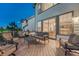 A spacious deck offers outdoor seating and grilling with views and access to the home's interior at 12350 Turquoise Terrace St, Castle Pines, CO 80108