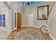 Grand foyer featuring hardwood floors, a large mirror, and a staircase leading to the upper level at 12350 Turquoise Terrace St, Castle Pines, CO 80108