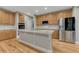 Kitchen featuring granite countertops, stainless steel appliances, and wood floors at 12350 Turquoise Terrace St, Castle Pines, CO 80108