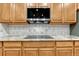 Close up of kitchen with stainless steel appliances and tile backsplash at 12350 Turquoise Terrace St, Castle Pines, CO 80108