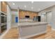 Gourmet kitchen features an island, stainless steel appliances, granite counters, and wood floors at 12350 Turquoise Terrace St, Castle Pines, CO 80108