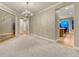 Spacious living room with carpet flooring, a chandelier, and an open layout at 12350 Turquoise Terrace St, Castle Pines, CO 80108