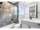 Modern bathroom featuring a glass enclosed shower with gray marble at 6529 Still Pine Cir, Castle Pines, CO 80108