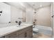 Modern bathroom features a shower/tub combo with white and beige tile at 6529 Still Pine Cir, Castle Pines, CO 80108