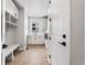 Well-lit laundry room with herringbone tile flooring, modern appliances, and ample storage at 6529 Still Pine Cir, Castle Pines, CO 80108