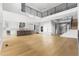 Spacious open-concept living room and kitchen with staircase at 6529 Still Pine Cir, Castle Pines, CO 80108