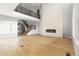 Bright living room featuring tall ceilings, fireplace, and open floor plan at 6529 Still Pine Cir, Castle Pines, CO 80108