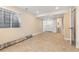 Open basement with tile floors, laundry closet with white washer and dryer, and a partially visible bathroom at 1018 Mulberry Ln, Highlands Ranch, CO 80129
