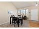 Bright dining space featuring a bay window and an adjacent seating area at 1018 Mulberry Ln, Highlands Ranch, CO 80129