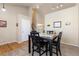 A cozy carpeted dining area, enhanced by natural light and a stairway nearby at 1018 Mulberry Ln, Highlands Ranch, CO 80129