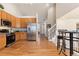 Bright kitchen with stainless steel appliances and an open layout into the dining area at 1018 Mulberry Ln, Highlands Ranch, CO 80129
