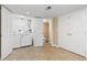 Laundry room features a white washer, dryer, shelving, and access to a bathroom with a neutral color palette at 1018 Mulberry Ln, Highlands Ranch, CO 80129