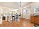A well-lit landing with a breakfast bar overlooks the living room with a fireplace at 1018 Mulberry Ln, Highlands Ranch, CO 80129