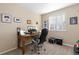 Well-lit home office featuring a spacious desk, comfortable chair, and window with natural light at 1018 Mulberry Ln, Highlands Ranch, CO 80129