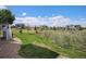 Backyard with patio, lush lawn, and gravel path at 7692 Weaver Cir, Castle Rock, CO 80104