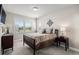 Well-lit bedroom with two windows, soft carpet, and a comfortable bed for a peaceful retreat at 7692 Weaver Cir, Castle Rock, CO 80104