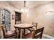 Dining room with a barrel mural, seating for four, and custom accent lighting at 7692 Weaver Cir, Castle Rock, CO 80104