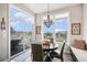 Bright dining area with large windows offering scenic views at 7692 Weaver Cir, Castle Rock, CO 80104