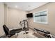 Home gym featuring a treadmill, stationary bike, weight bench, and window to provide ample natural light at 7692 Weaver Cir, Castle Rock, CO 80104