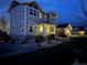 Front exterior view featuring attractive landscaping and outdoor lighting, enhancing curb appeal at night at 7692 Weaver Cir, Castle Rock, CO 80104