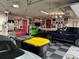 A spacious garage featuring a checkered floor, cars, and decorative wall art at 7692 Weaver Cir, Castle Rock, CO 80104