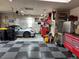 Garage featuring checkered flooring, car, and mechanic's tool storage at 7692 Weaver Cir, Castle Rock, CO 80104