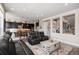 Spacious living room is open to kitchen and staircase at 7692 Weaver Cir, Castle Rock, CO 80104