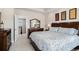 Inviting bedroom with an open door to the hallway, neutral walls, and a beautiful wood dresser at 7692 Weaver Cir, Castle Rock, CO 80104