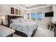Comfortable bedroom with large windows providing scenic neighborhood views and a decorative bed frame at 7692 Weaver Cir, Castle Rock, CO 80104