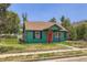 Charming home with a red front door and well-maintained green exterior at 4730 S Huron St, Englewood, CO 80110