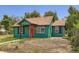 Charming home with a red front door and well-maintained green exterior at 4730 S Huron St, Englewood, CO 80110