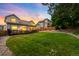 Expansive backyard featuring a dark wood deck perfect for outdoor gatherings and leisurely relaxation at 7038 Russell Ct, Arvada, CO 80007
