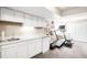 Finished basement features a sink, mini-fridge, treadmill, and ample storage, perfect for recreation and hobbies at 7038 Russell Ct, Arvada, CO 80007
