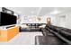 Cozy living room featuring a large sectional sofa, a media console, and stylish decor for a relaxed atmosphere at 7038 Russell Ct, Arvada, CO 80007