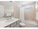 Bathroom with a modern sink, bathtub, shower and a sunlit window at 490 Silver Rock Trl, Castle Rock, CO 80104