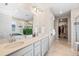 This bright bathroom offers a soaking tub, a dual sink vanity, and a closet at 490 Silver Rock Trl, Castle Rock, CO 80104