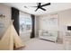Bright Bedroom featuring a teepee and crib with plenty of natural light at 490 Silver Rock Trl, Castle Rock, CO 80104