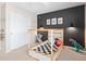 Fun room features a checkered race car bed and accent wall at 490 Silver Rock Trl, Castle Rock, CO 80104